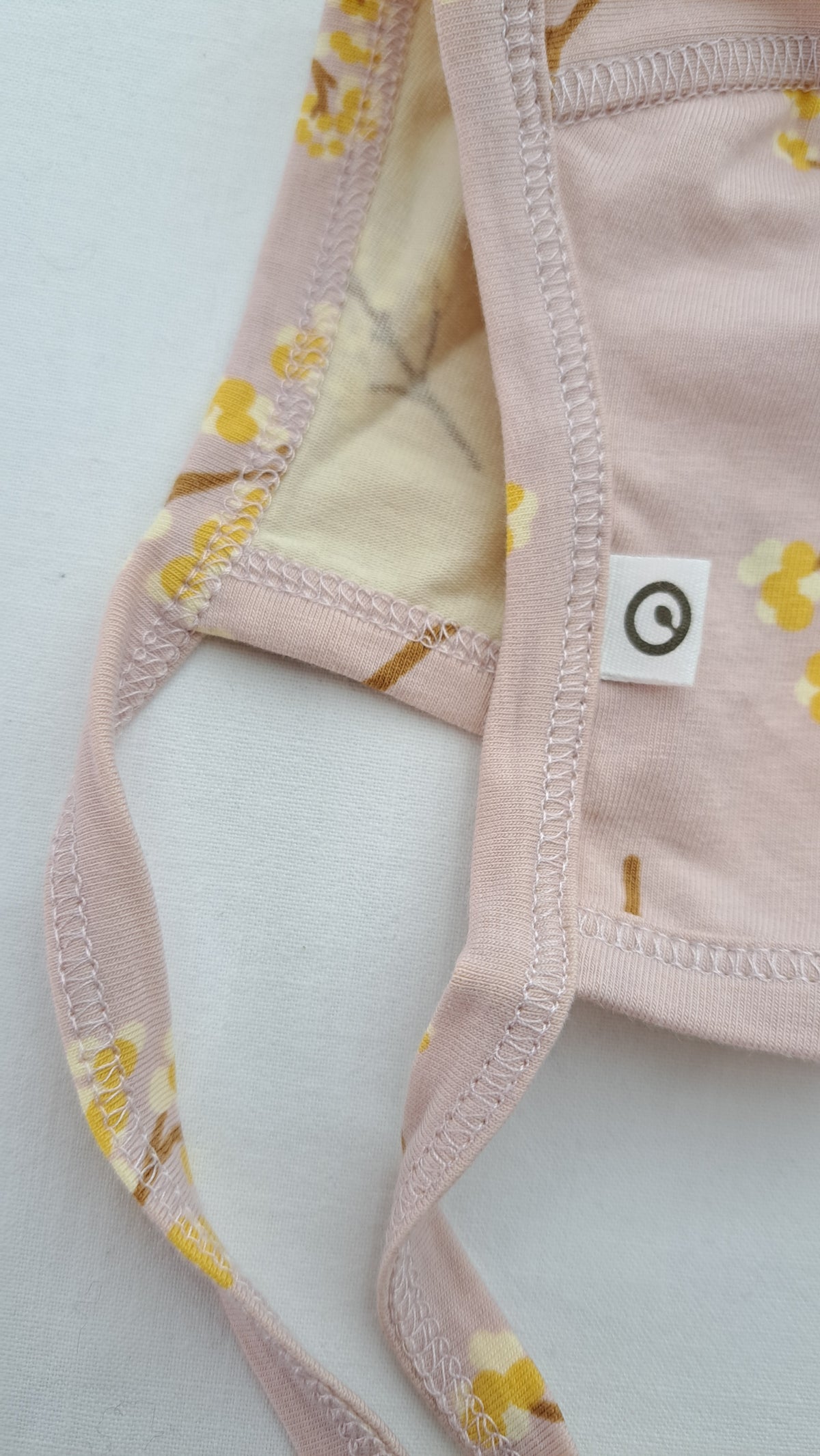 MÜSLI BY GREEN COTTON • HJÄLM • FILIPENDULA ROSE MOON • STORL. 0-3 MÅN.